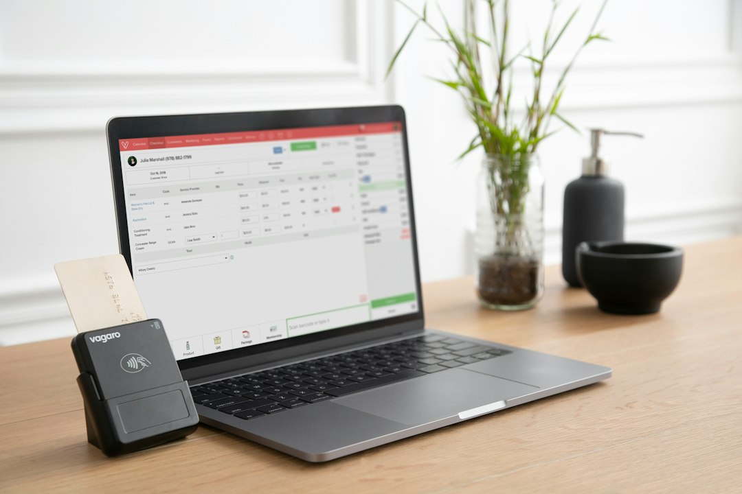 Electronic payment terminal and laptop representing NEFT RTGS and IMPS transfers