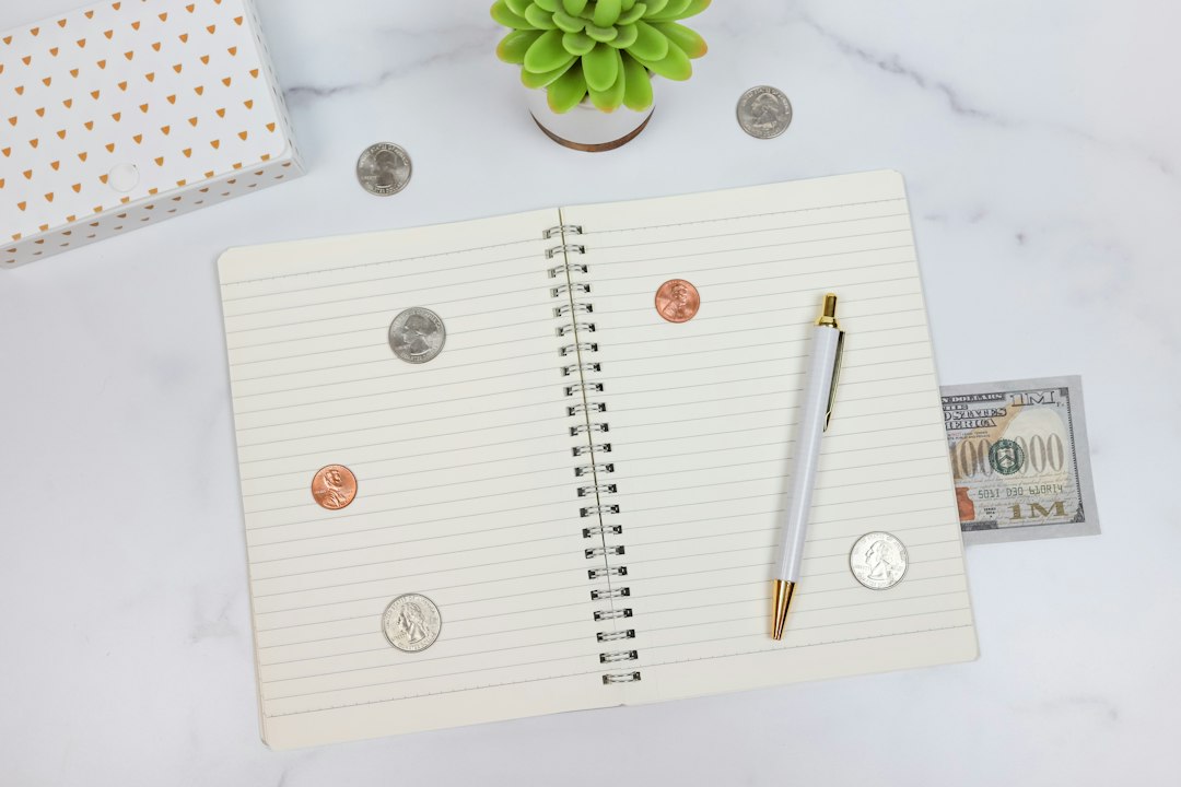 Budget planning notebook and money concept for the 50 30 20 budget rule