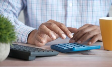 Calculator used to compare debt payments with monthly income