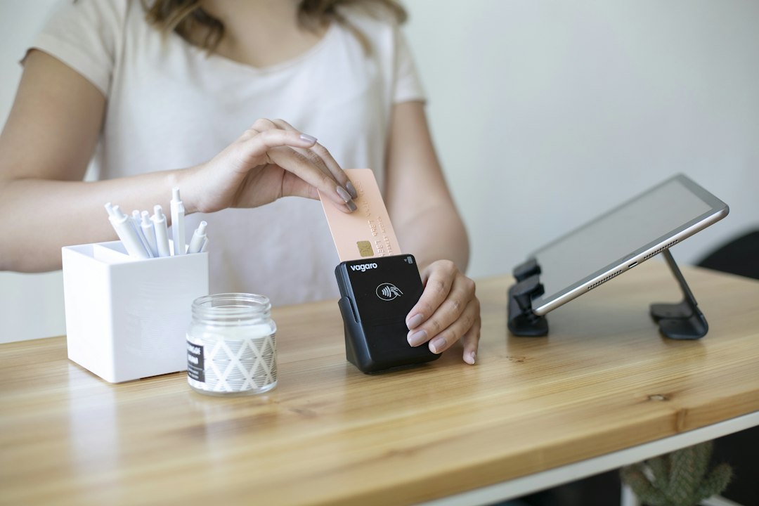 Card being used at a payment terminal, illustrating credit-card cashback