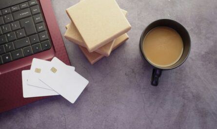 Laptop and coffee on a desk illustrating credit-card statement review