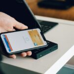 Credit card beside smartphone showing digital payment methods