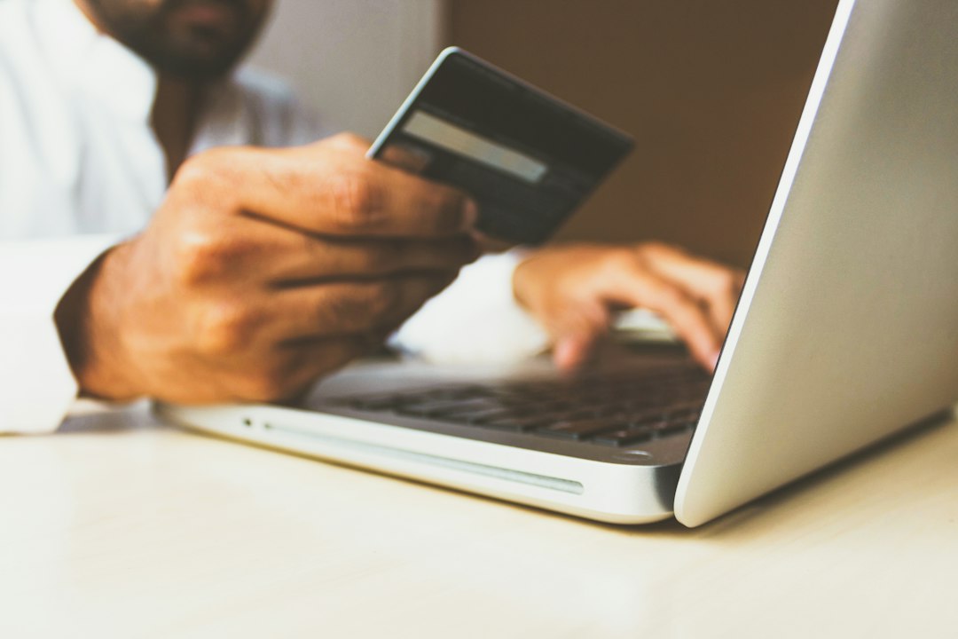 Credit card and smartphone representing minimum amount due and statement payment