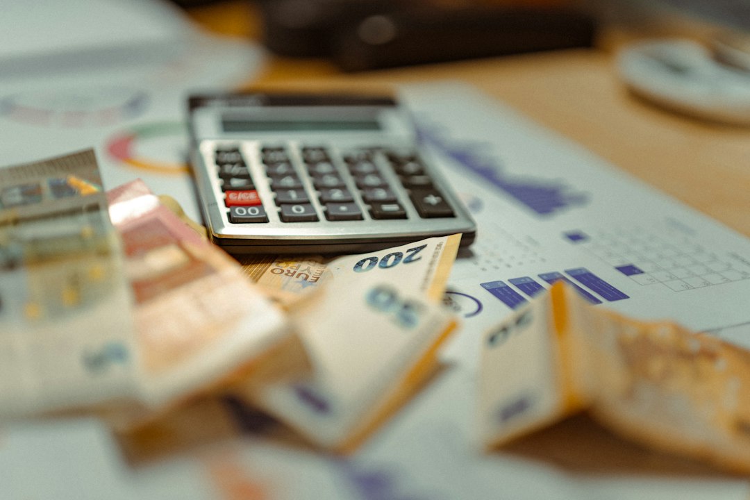 Spreadsheet and money concept for tracking monthly household expenses