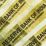 Indian banknotes representing unclaimed deposits on RBI UDGAM portal
